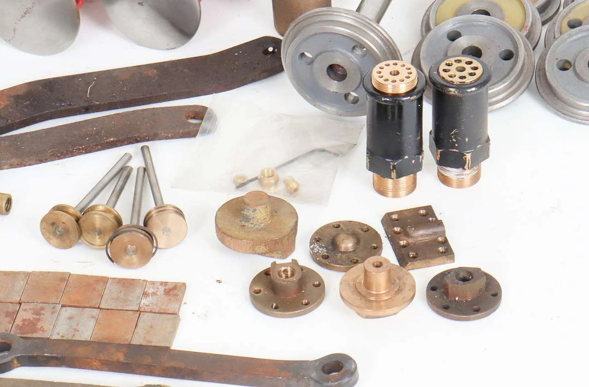 Large box of assorted parts and castings