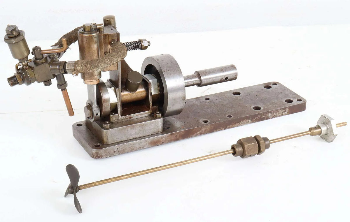 Oscillating engine with marine flywheel, propshaft and propeller