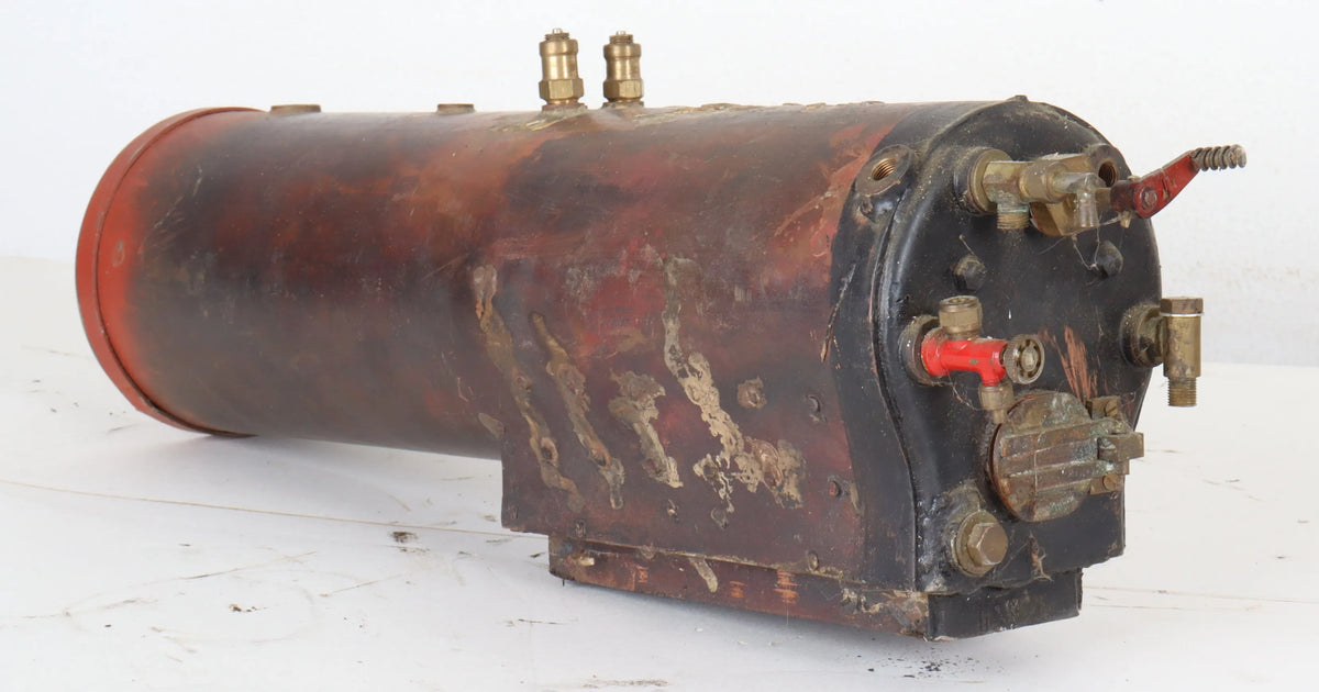Three small locomotive boilers