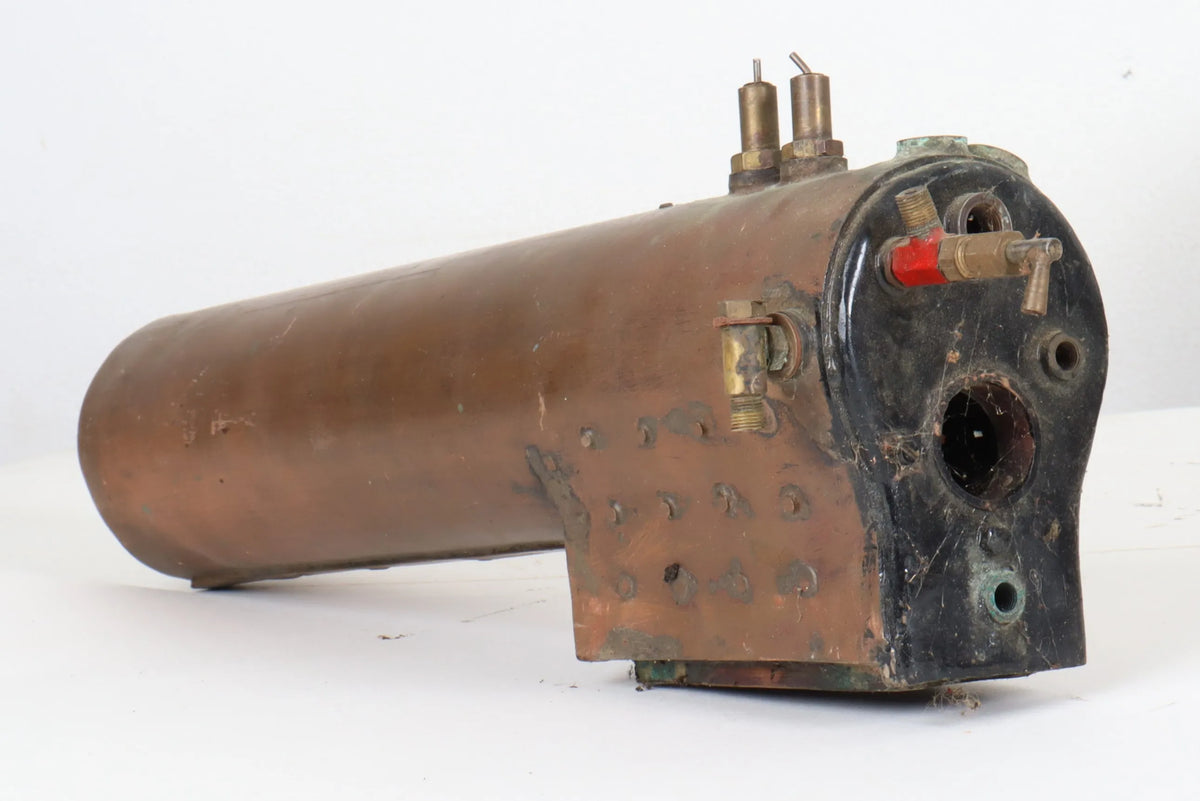 Three small locomotive boilers