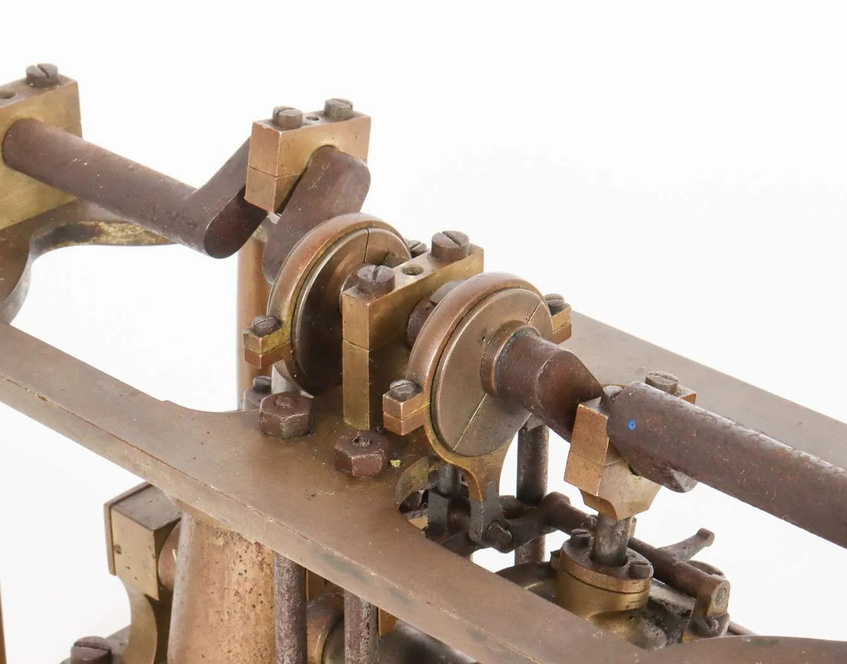 Oscillating twin cylinder vertical engine