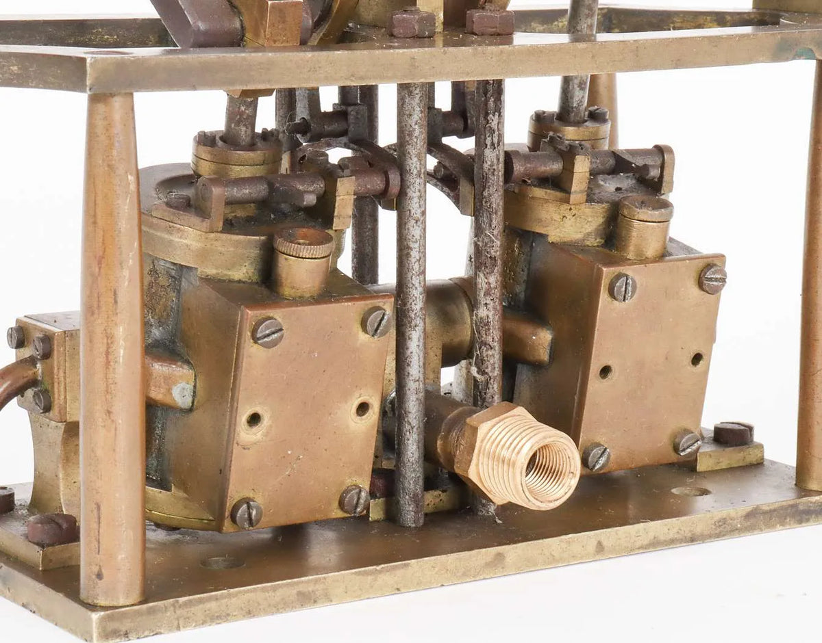 Oscillating twin cylinder vertical engine