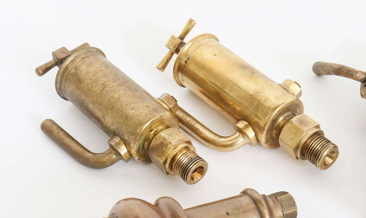 Collection of full-size lubricators, safety valve, whistle