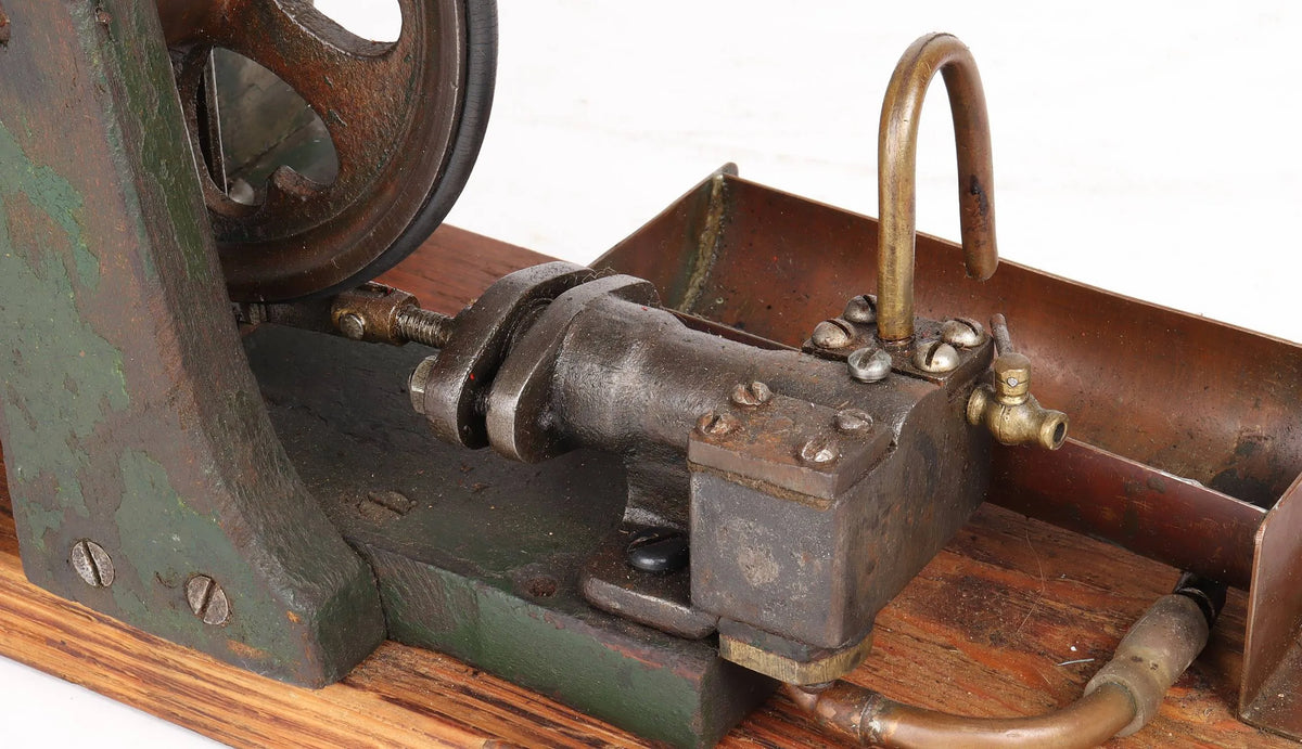 Vintage single cylinder vertical engine with pump