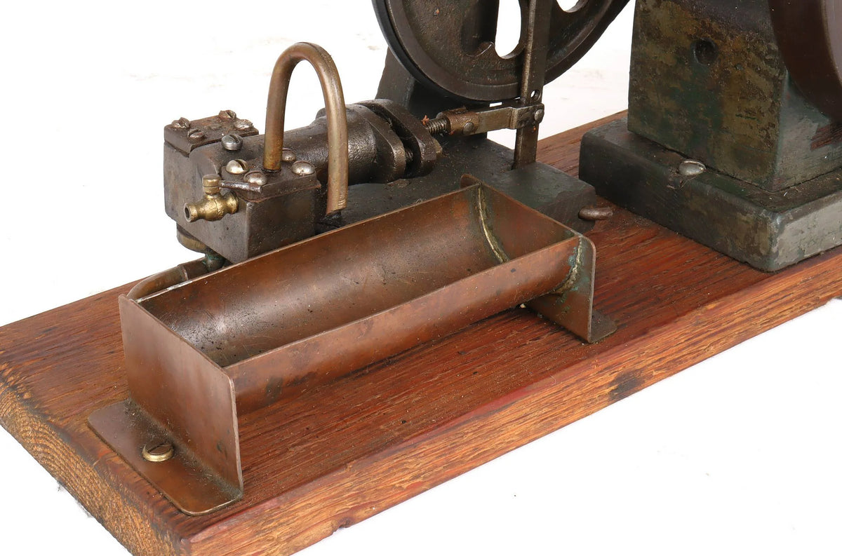 Vintage single cylinder vertical engine with pump