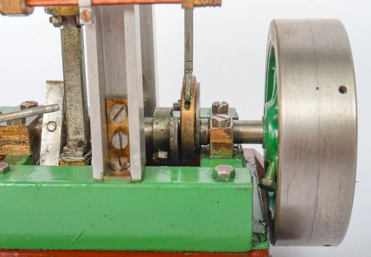 Twin cylinder vertical engine with slip eccentric reversing gear