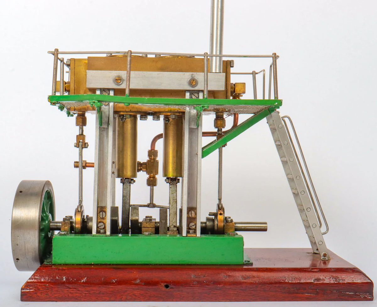 Twin cylinder vertical engine with slip eccentric reversing gear