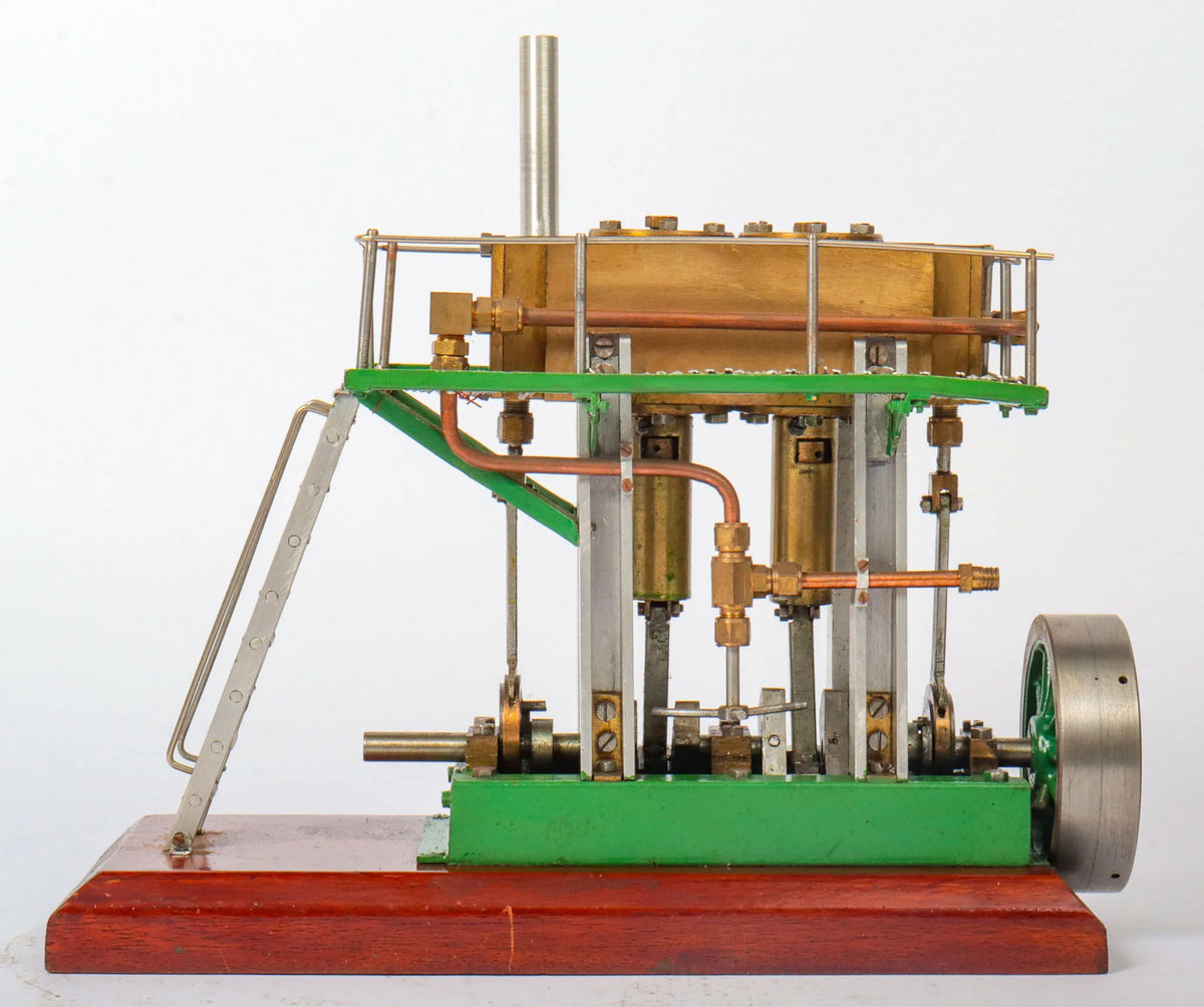 Twin cylinder vertical engine with slip eccentric reversing gear