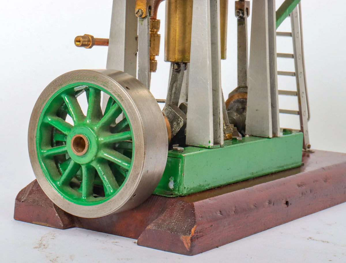 Twin cylinder vertical engine with slip eccentric reversing gear