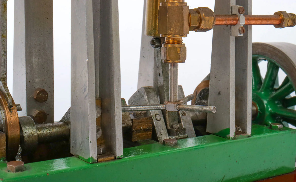 Twin cylinder vertical engine with slip eccentric reversing gear