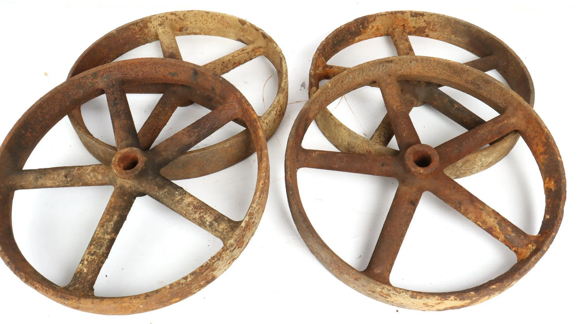 Four 12 inch cast iron wheels