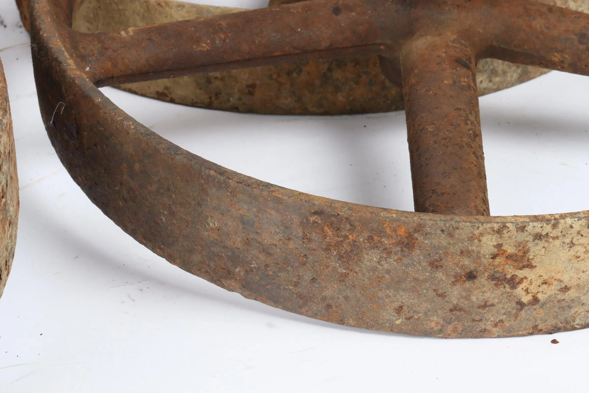 Four 12 inch cast iron wheels