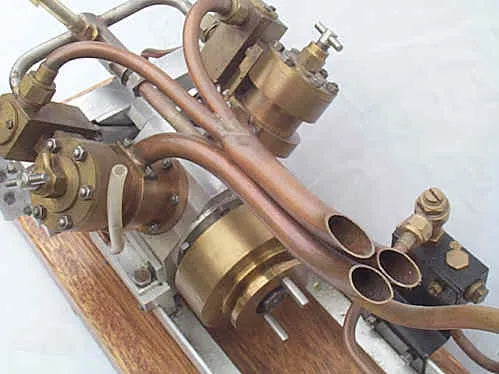 High speed V-twin marine engine and Scott boiler