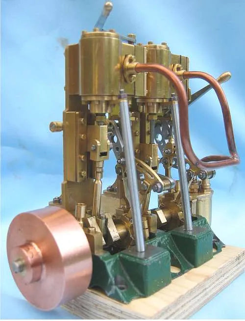 Twin cylinder vertical engine with reversing gear