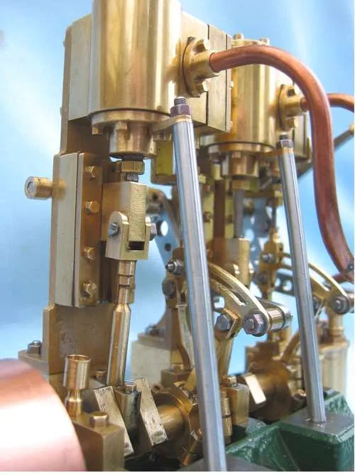 Twin cylinder vertical engine with reversing gear