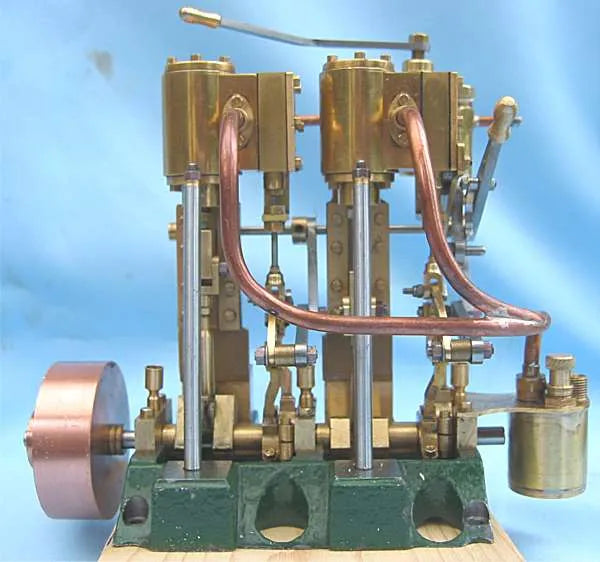 Twin cylinder vertical engine with reversing gear