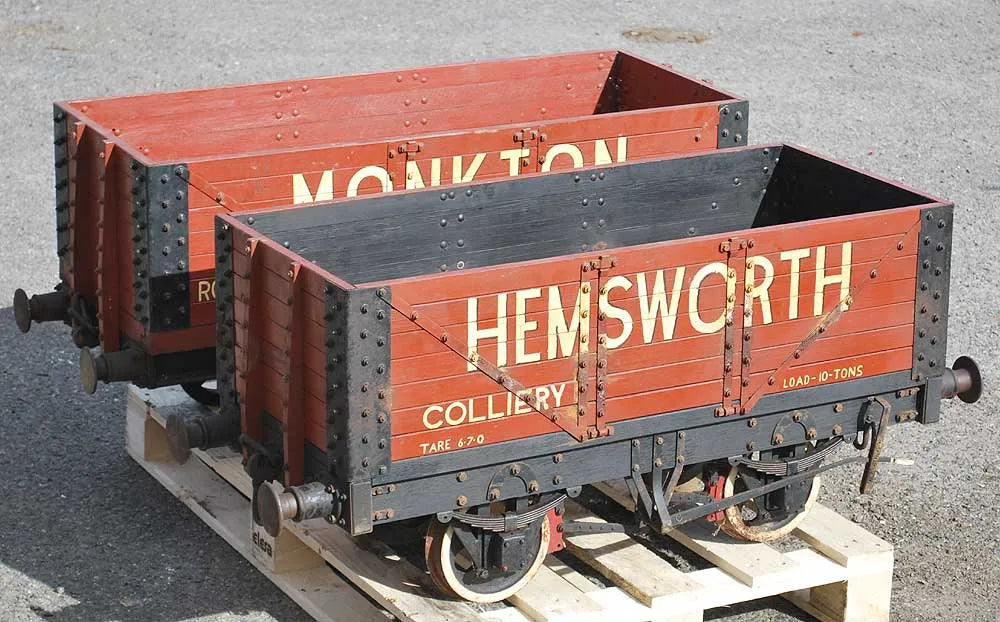 Five 10 1/4 inch gauge wagons and brake van