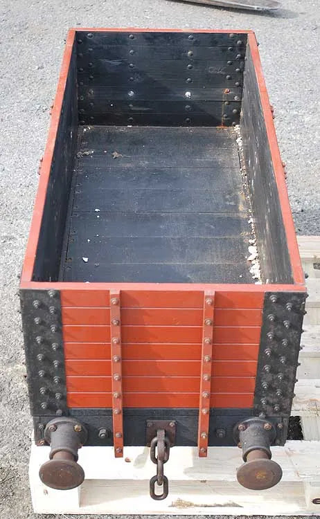 Five 10 1/4 inch gauge wagons and brake van
