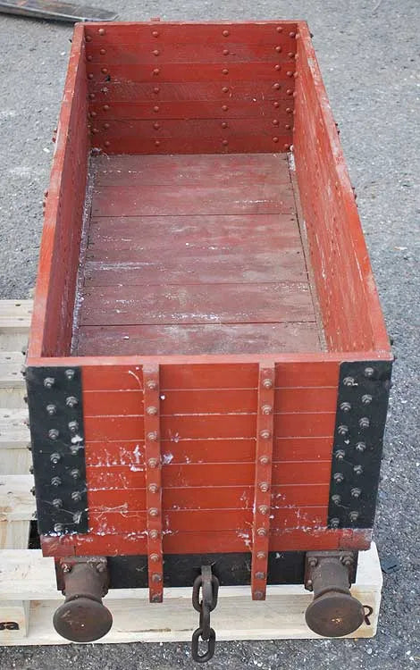 Five 10 1/4 inch gauge wagons and brake van