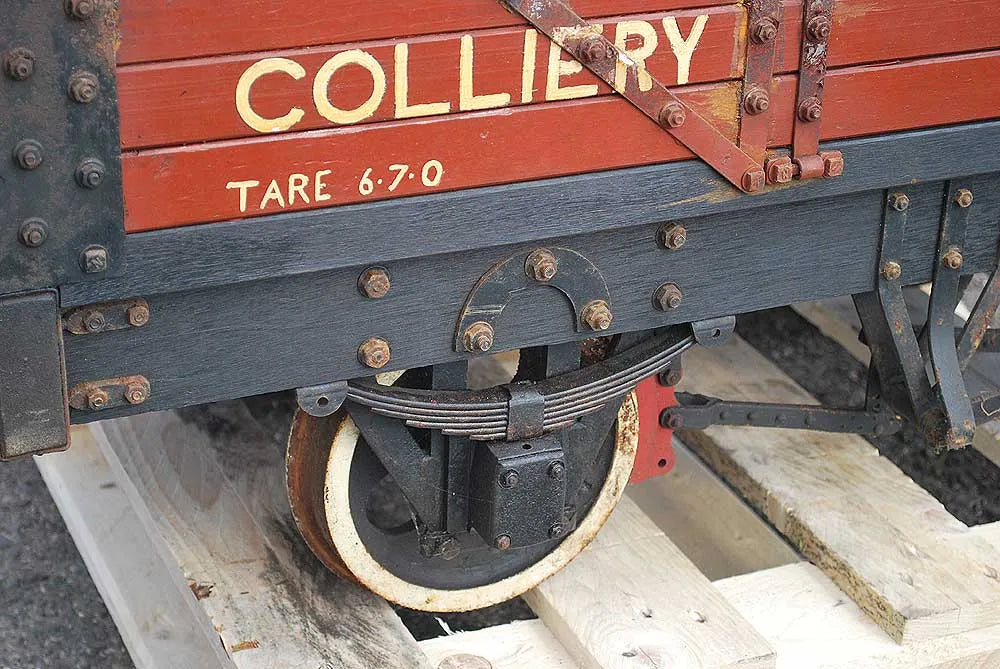 Five 10 1/4 inch gauge wagons and brake van