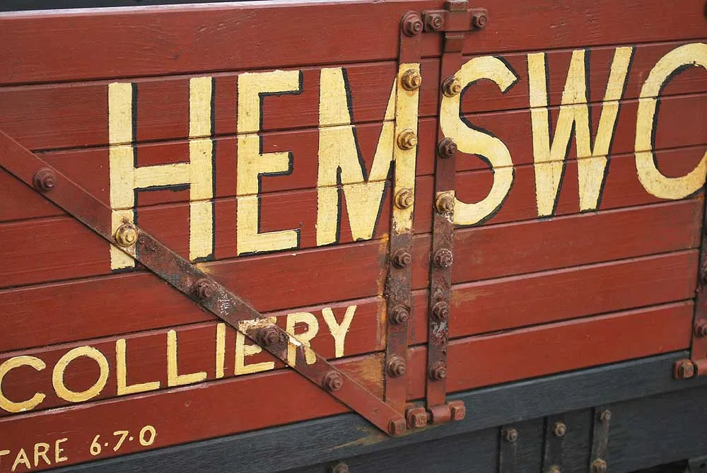 Five 10 1/4 inch gauge wagons and brake van
