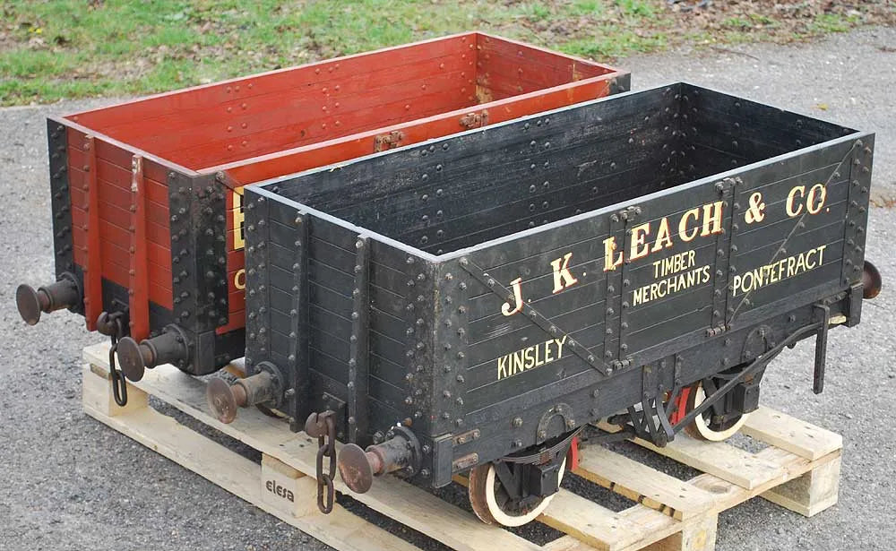 Five 10 1/4 inch gauge wagons and brake van