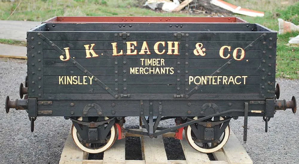 Five 10 1/4 inch gauge wagons and brake van