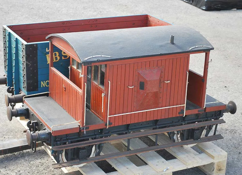 Five 10 1/4 inch gauge wagons and brake van