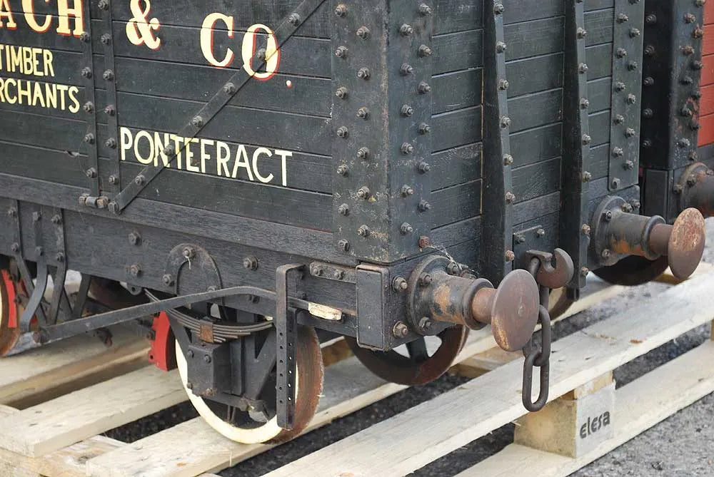 Five 10 1/4 inch gauge wagons and brake van