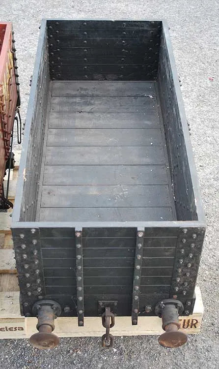 Five 10 1/4 inch gauge wagons and brake van