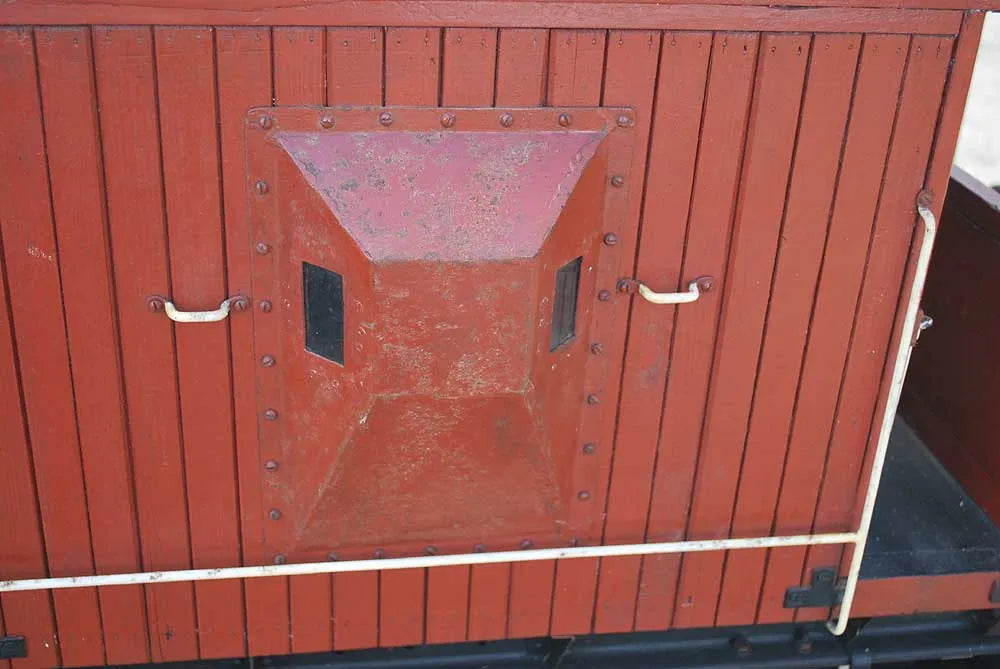 Five 10 1/4 inch gauge wagons and brake van