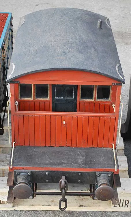 Five 10 1/4 inch gauge wagons and brake van
