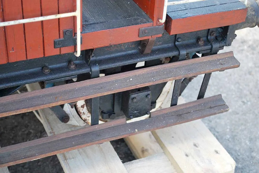 Five 10 1/4 inch gauge wagons and brake van