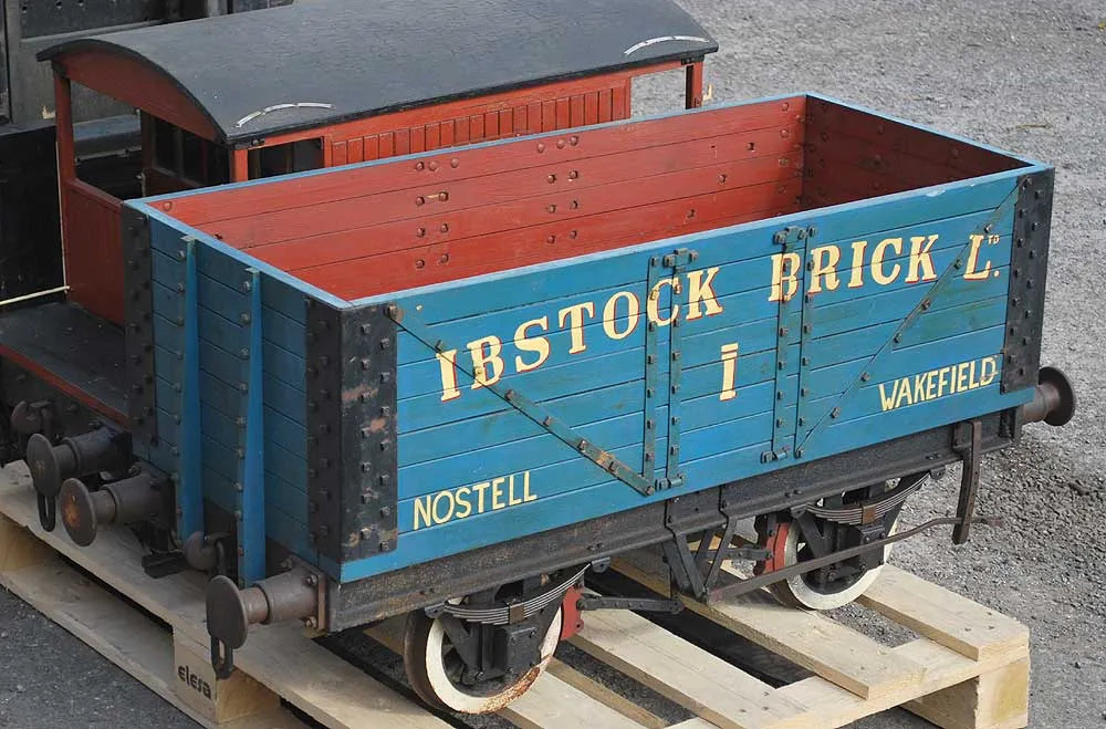 Five 10 1/4 inch gauge wagons and brake van