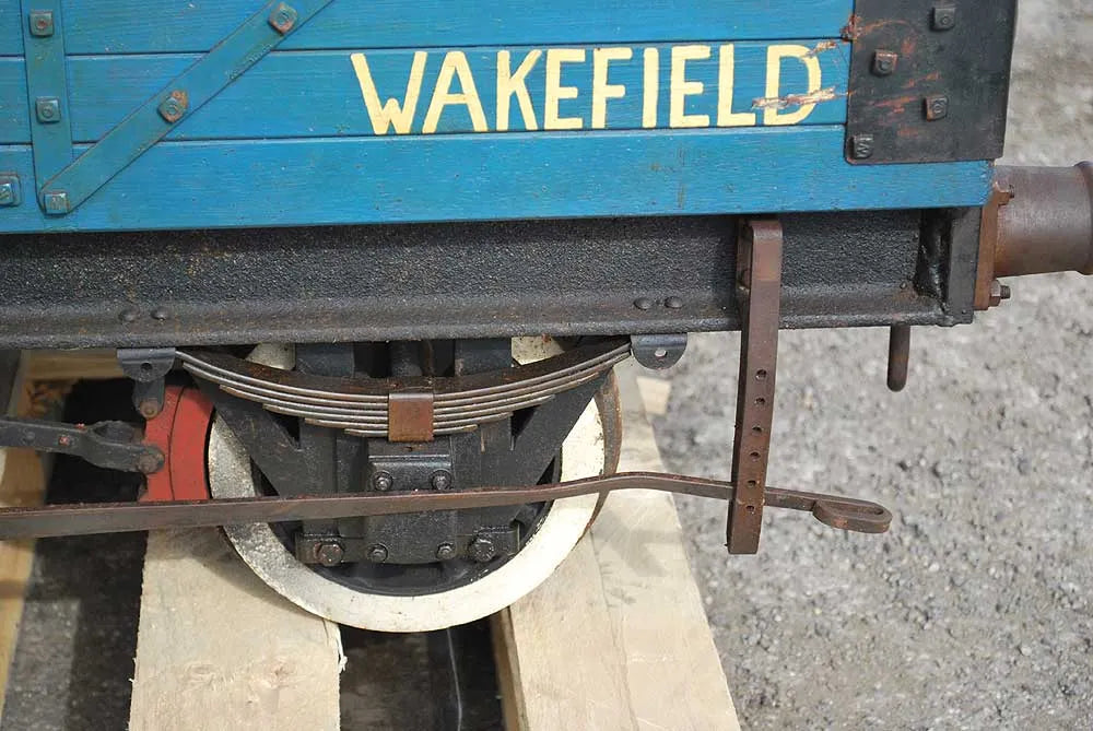 Five 10 1/4 inch gauge wagons and brake van