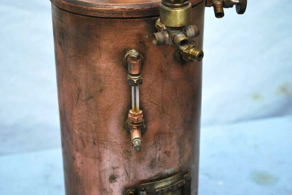 Vertical copper boiler with hand pump