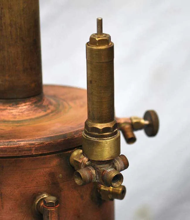 Vertical copper boiler with hand pump