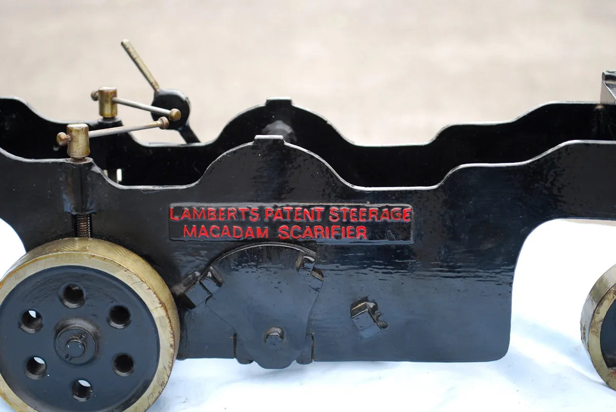 Five 2 inch scale road-laying models