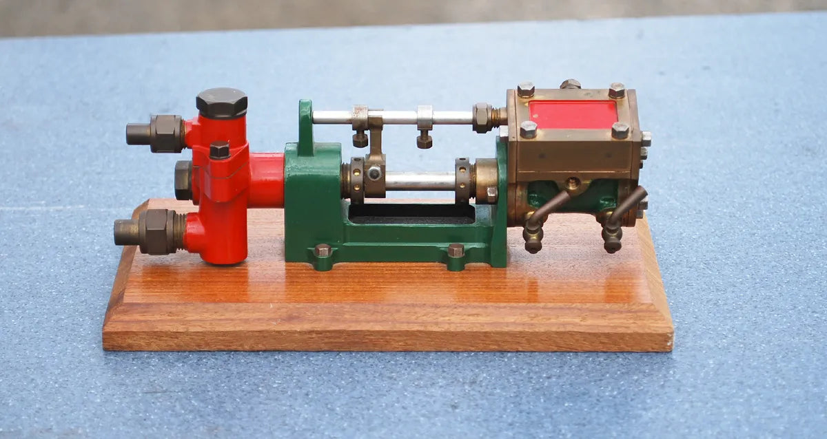 Stuart steam pump on wooden base