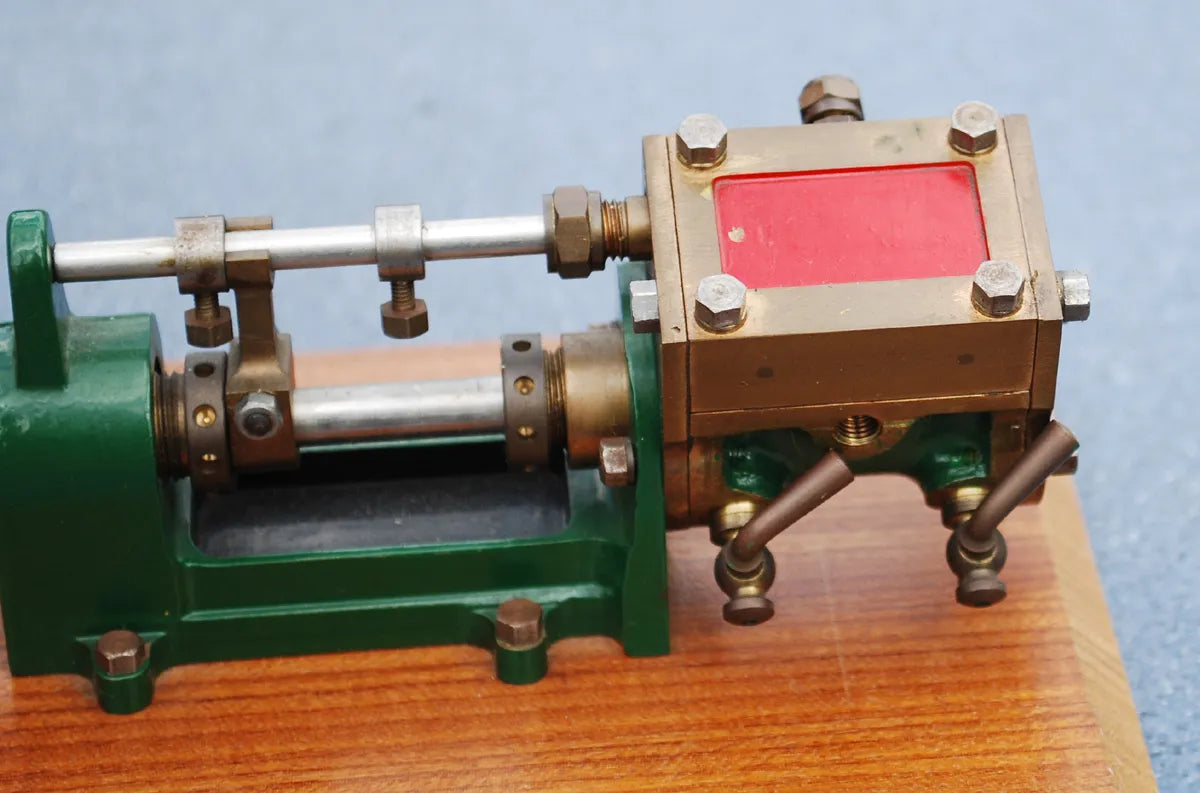 Stuart steam pump on wooden base