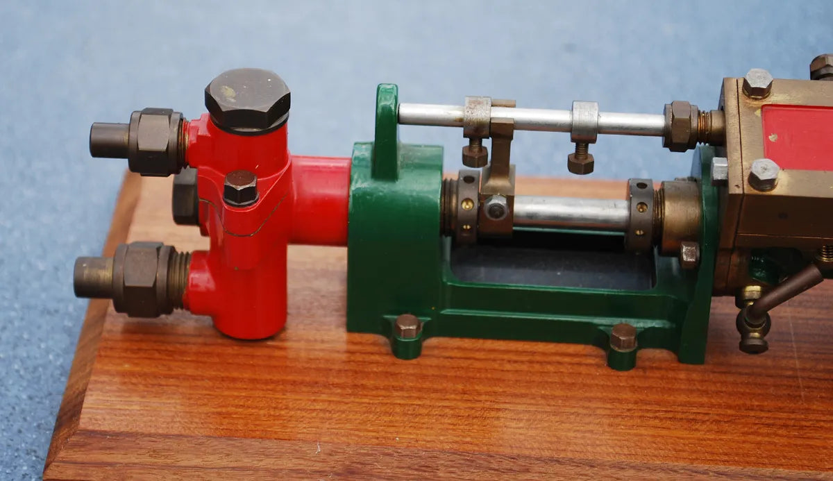 Stuart steam pump on wooden base