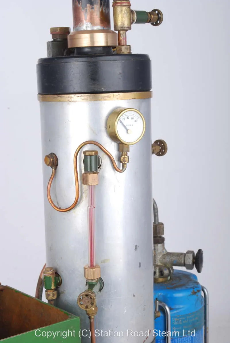 Gas fired boiler with water tank and hand pump
