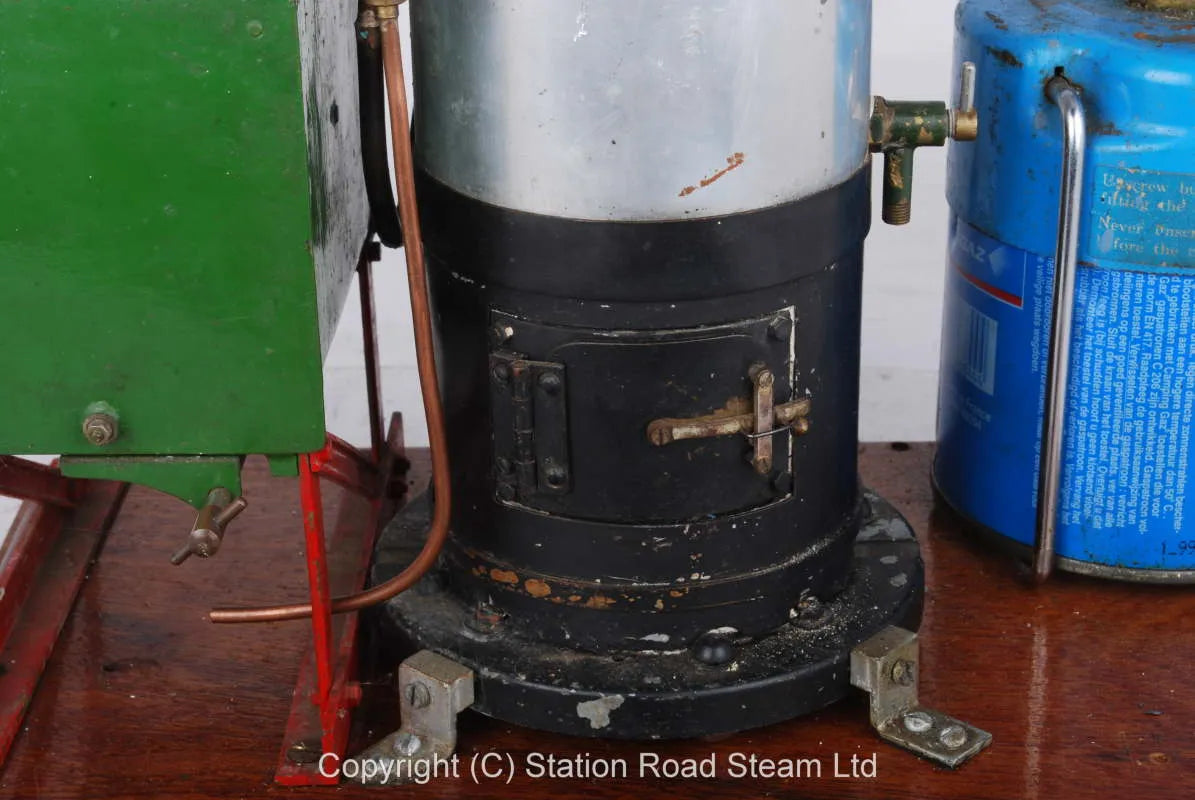 Gas fired boiler with water tank and hand pump