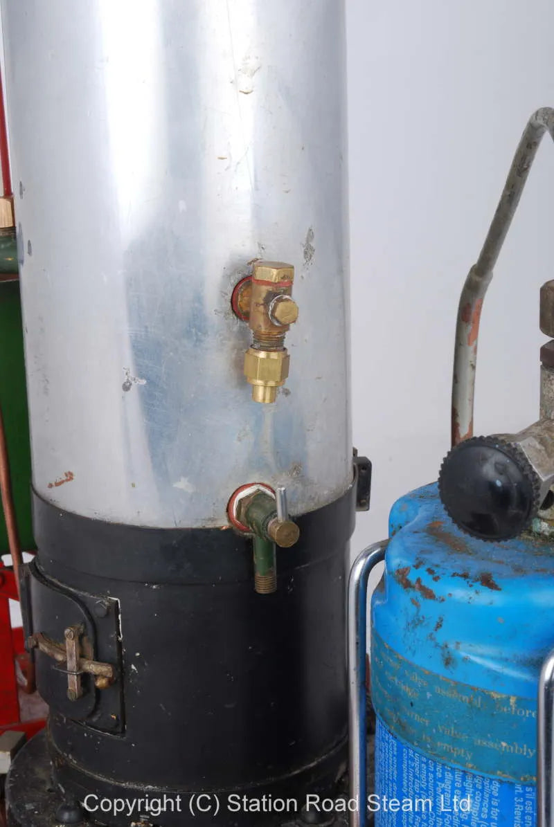 Gas fired boiler with water tank and hand pump
