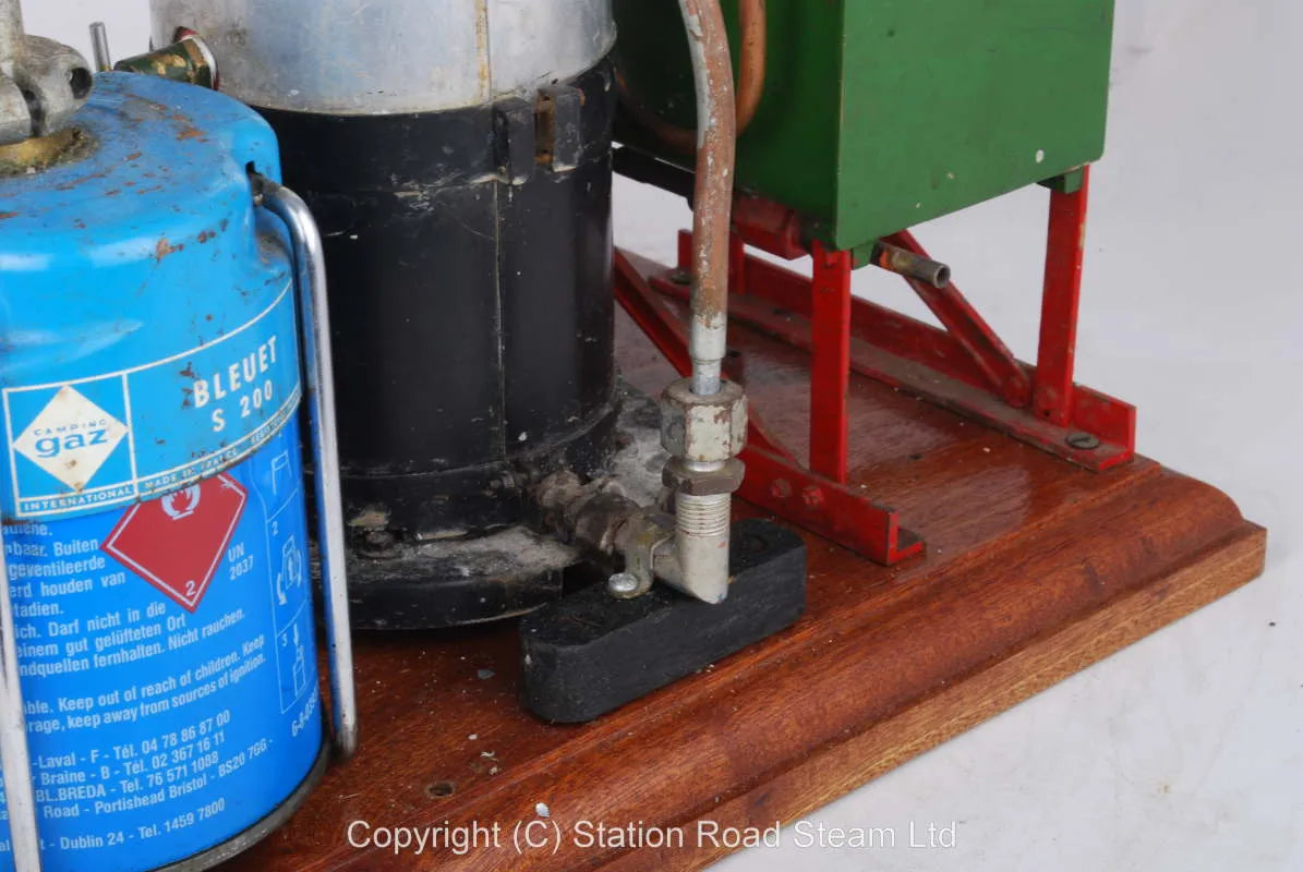 Gas fired boiler with water tank and hand pump