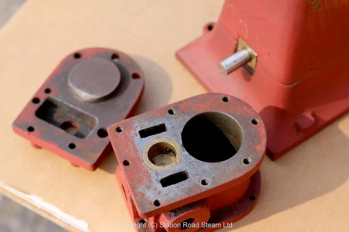 Part-built piston valve vertical engine