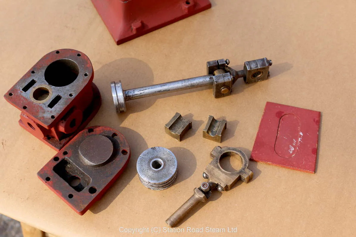 Part-built piston valve vertical engine
