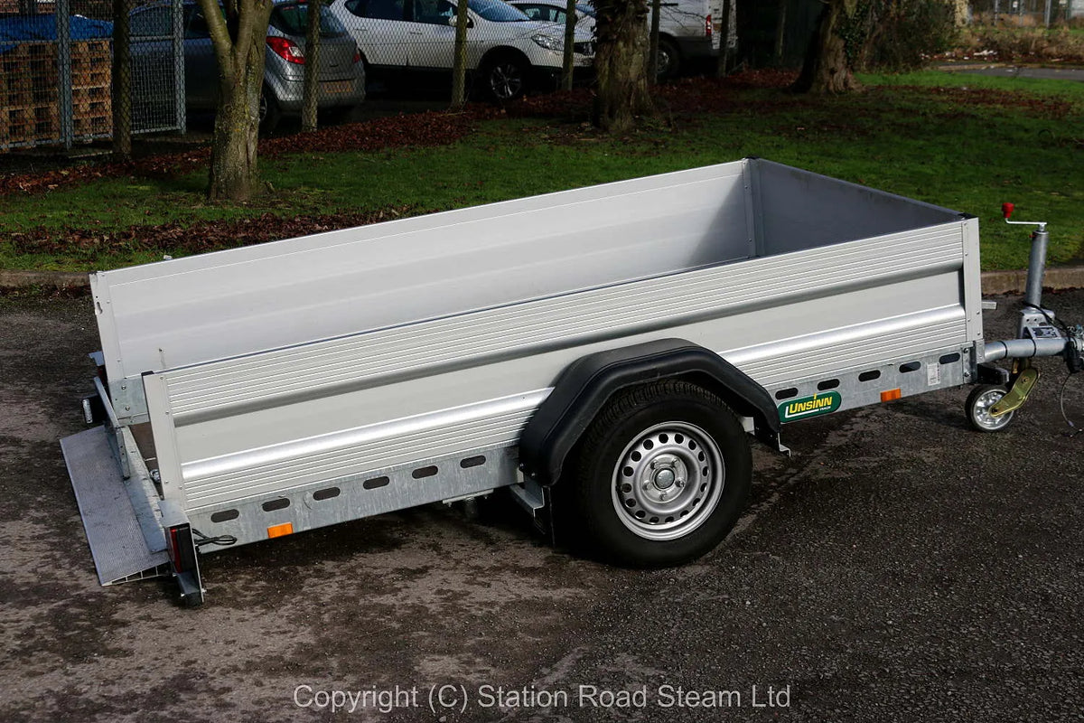 Two wheel tilt bed trailer