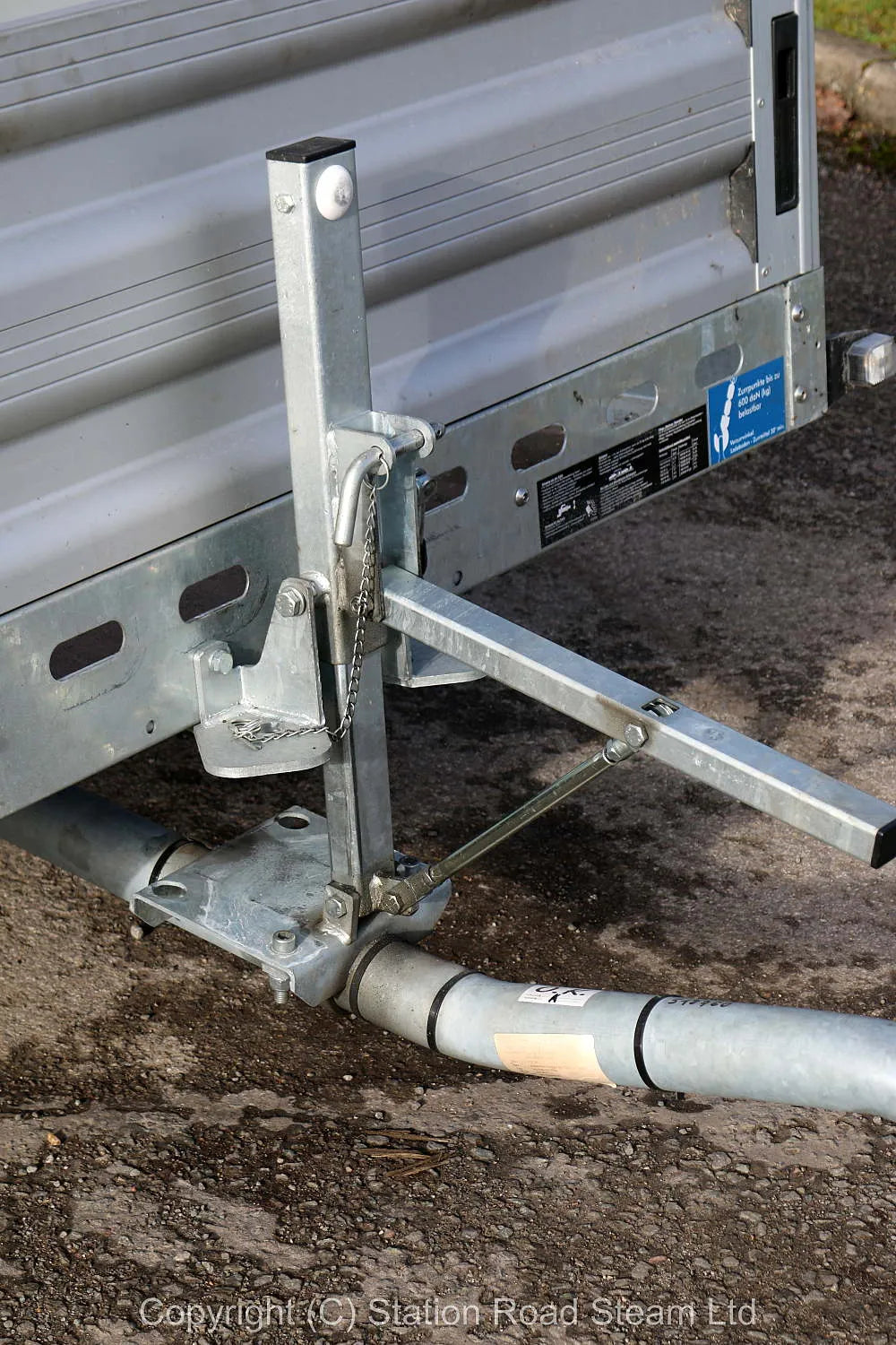 Two wheel tilt bed trailer