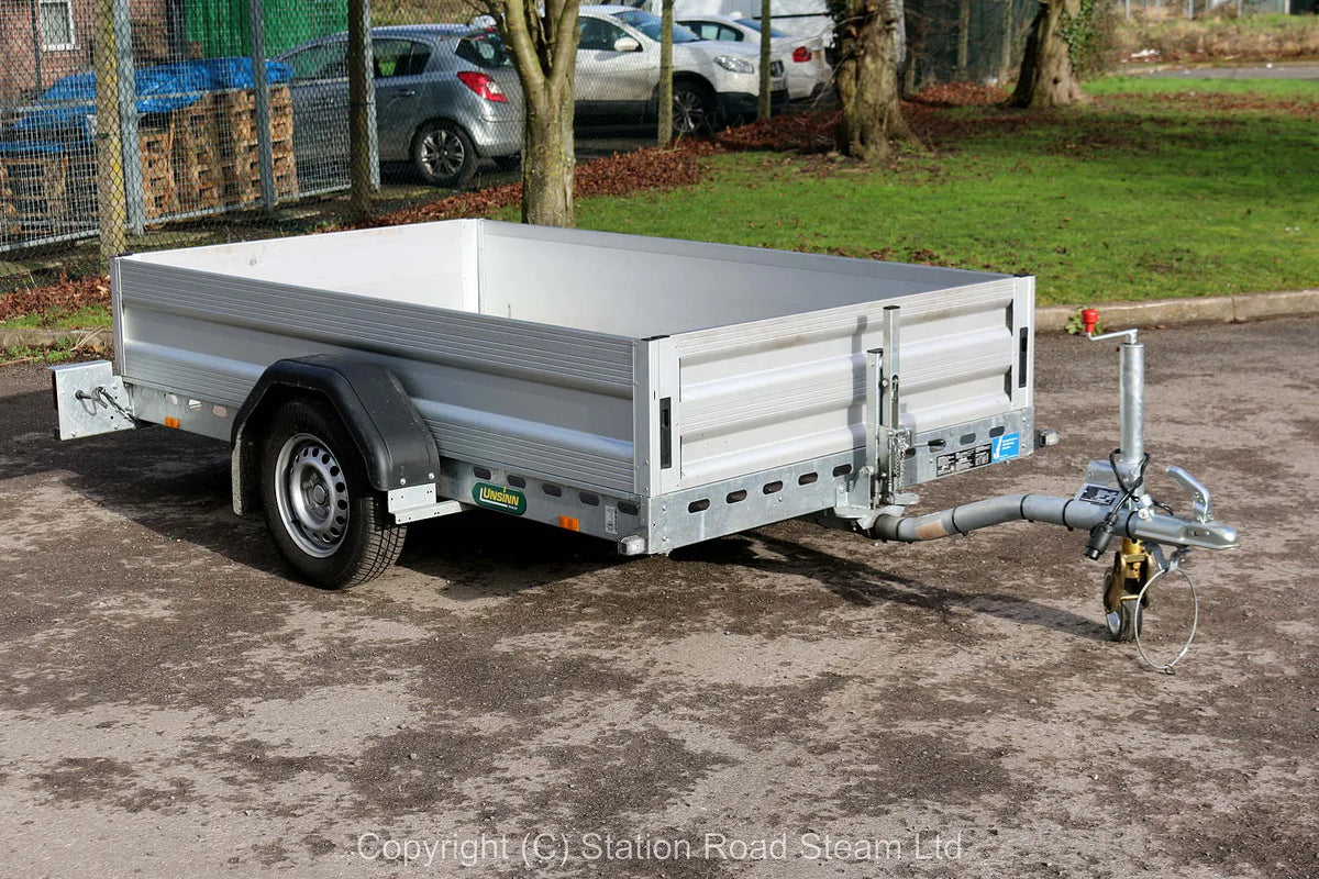 Two wheel tilt bed trailer